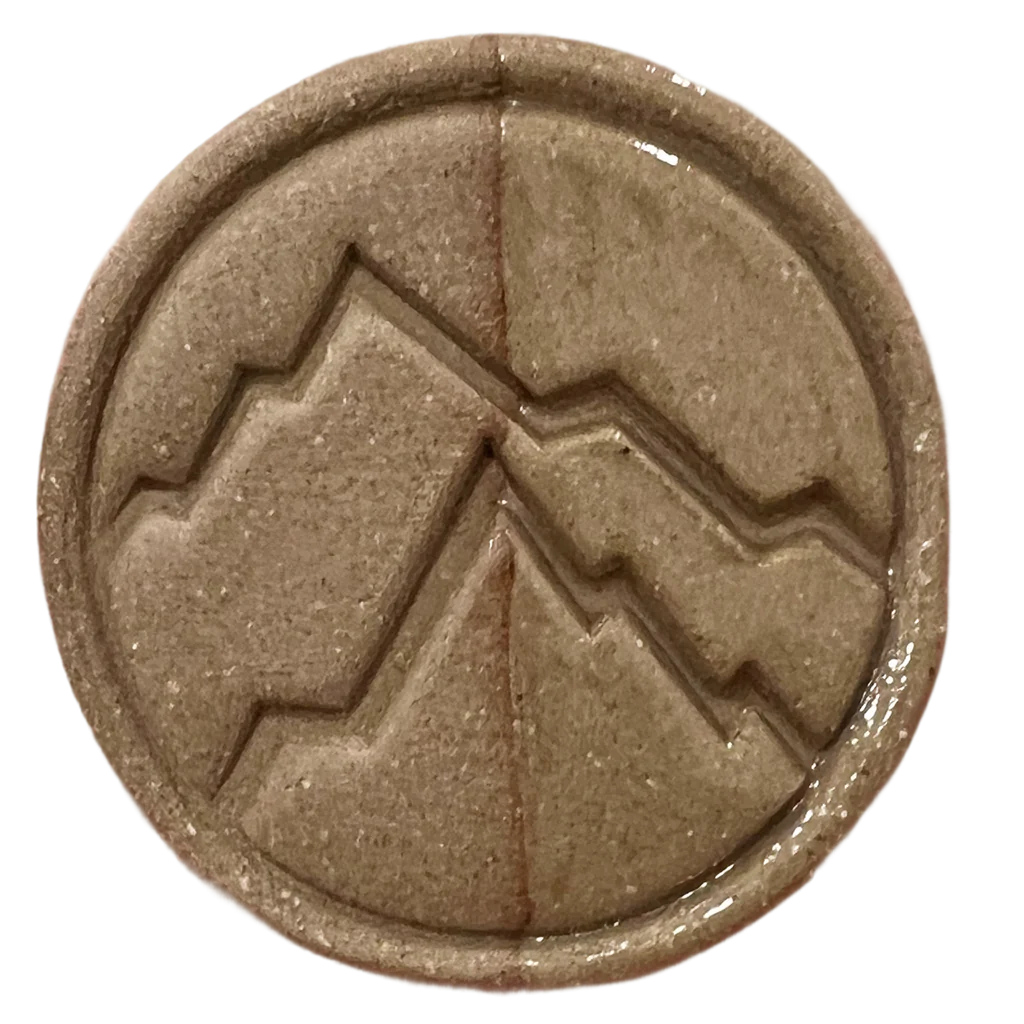 Chestnut test tile from Rocky Mountain Clay showing warm dark brown oxidation result