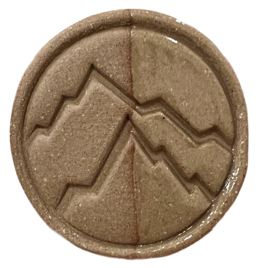 Chestnut test tile from Rocky Mountain Clay showing warm dark brown oxidation result