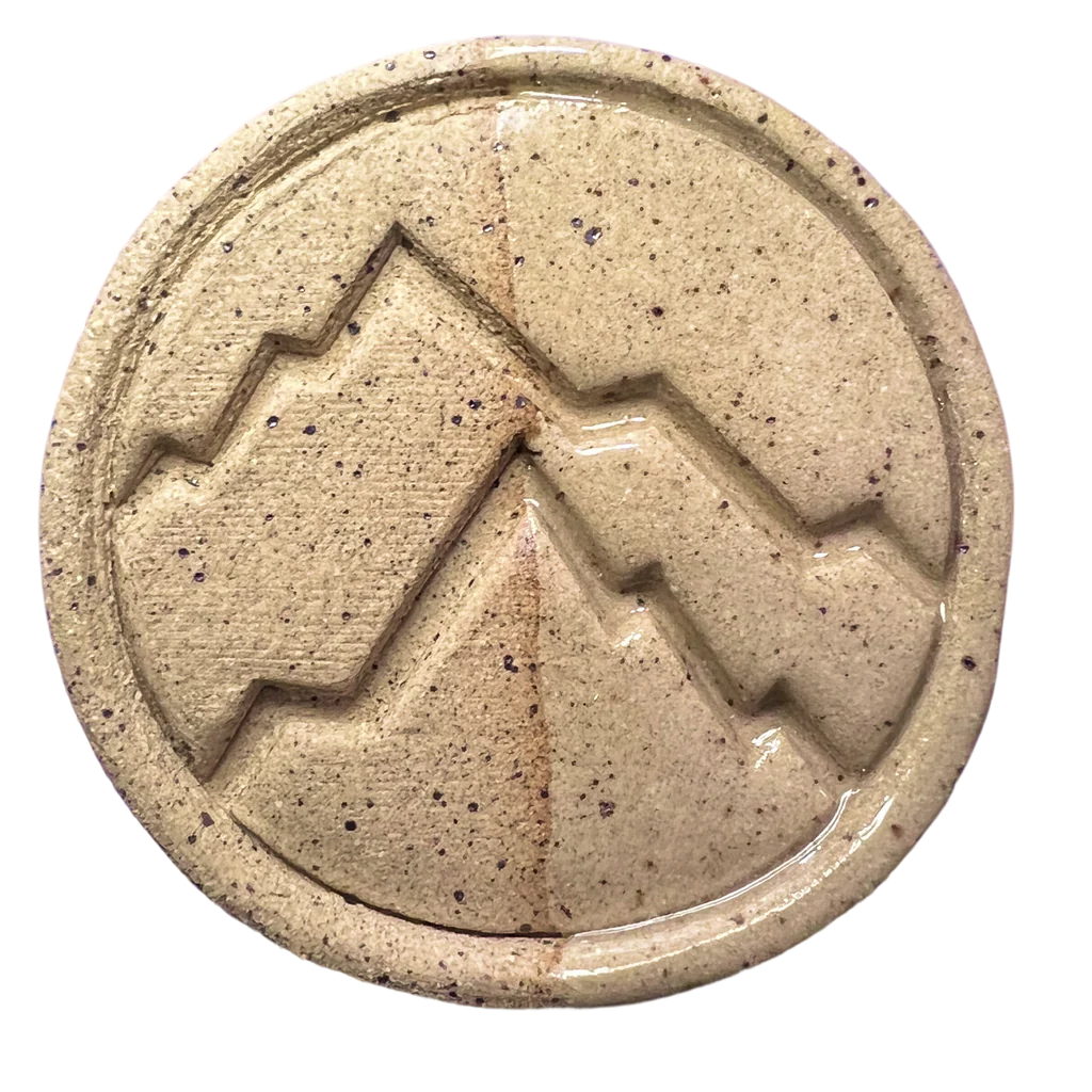 Speckled Brown Trout test tile showing medium brown oxidation with visible specks